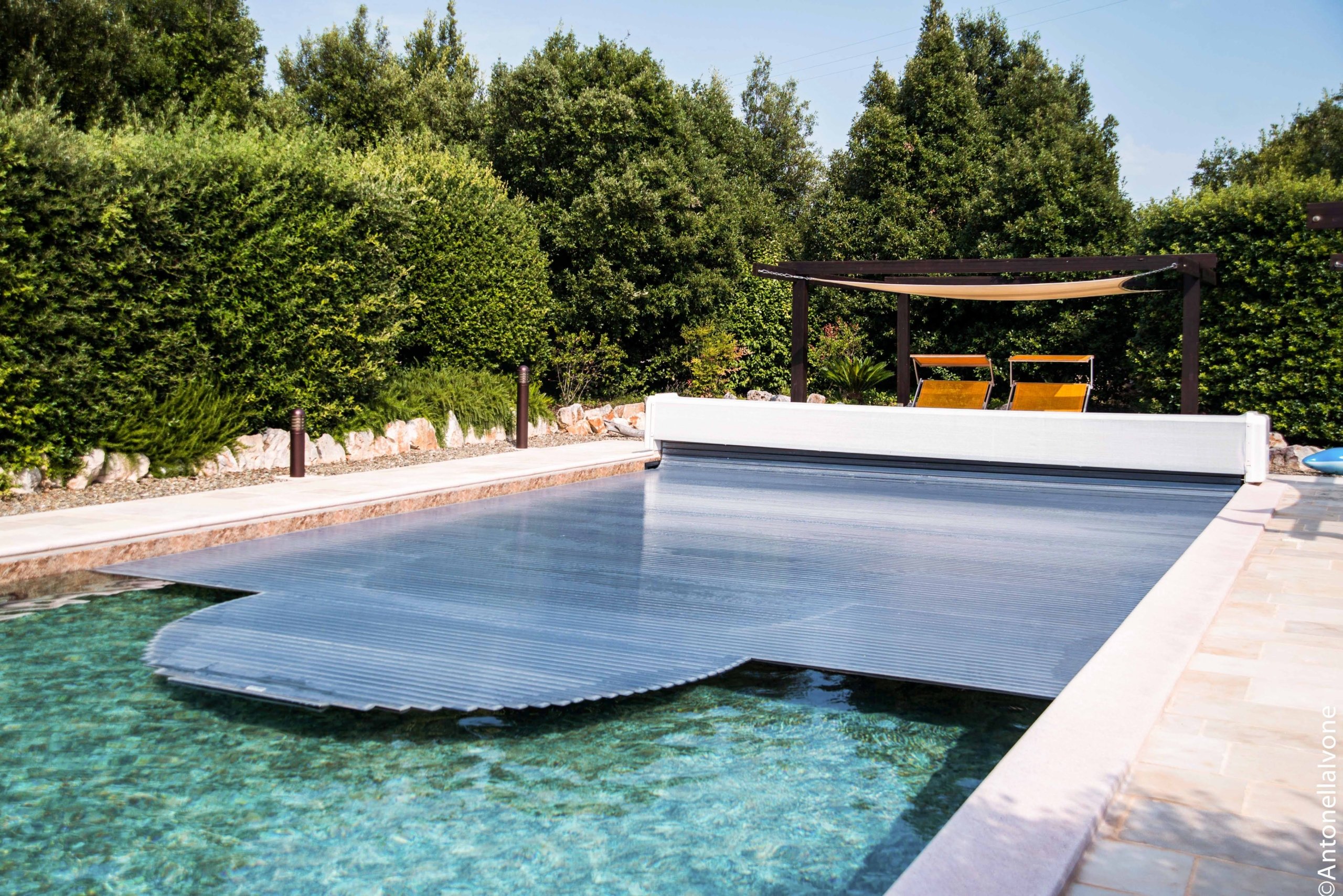 Swimming pool cover to maintain desired temperature.